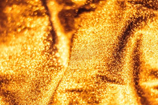 Luxe glowing texture, night club branding and New Years party concept - Golden holiday sparkling glitter abstract background, luxury shiny fabric material for glamour design and festive invitation