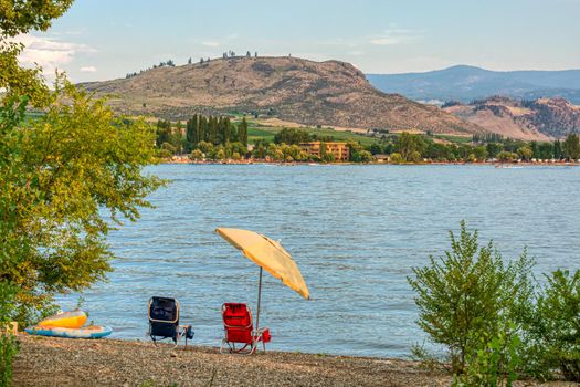 Small tourist camp with a lake overview on warm summer evening