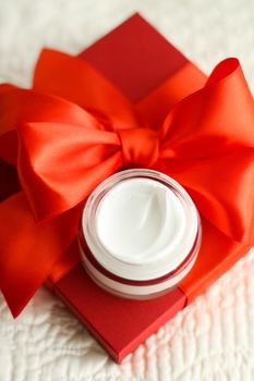 Beauty, cosmetics and skincare styled concept - Luxury face cream jar and red gift box