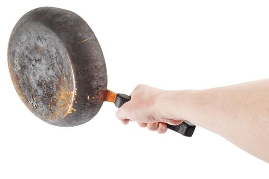 bare caucasian hand holding empty old cast iron frying pan - isolated on white background