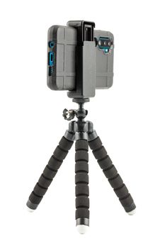 black cellphone in rugged rubber protective cover on small flexible tripod isolated on white background