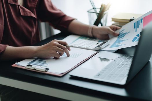 Close up view of bookkeeper or financial inspector hands making report, calculating or checking balance. Home finances, investment, economy, saving money or insurance concept
