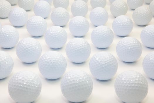 Pattern with white golf balls on the table.