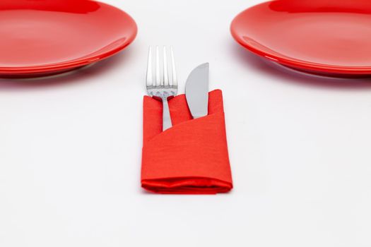Red plates on the white wooden table.Top view. Flat Lay Image.
