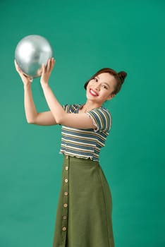 Close up of creativity woman dancing and celebrating on party, holding balloons by hands