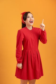 Beautiful Elegant young Woman happy cheering in red dress - playful and cheerful