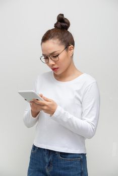Young asian woman showing a calculator.