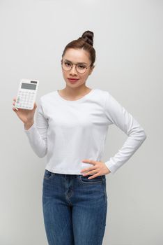 Dissatisfied young business woman in white shirt posing isolated on white background 