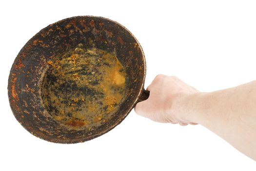 bare caucasian hand holding empty old cast iron frying pan - isolated on white background