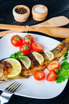Fried fish served on the plate