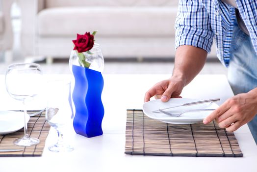 Man alone preparing for romantic date with his sweetheart