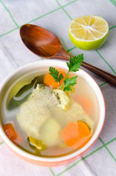 Fish soup served on the table in plate