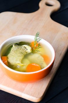 Fish soup served on the table in plate