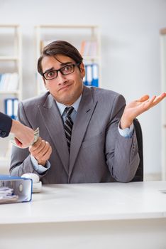 Businessman being offered bribe for breaking law