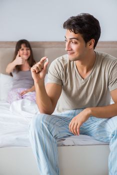 Man suffering from impotency with pill