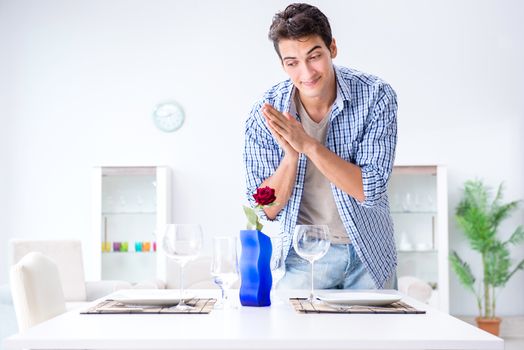 Man alone preparing for romantic date with his sweetheart