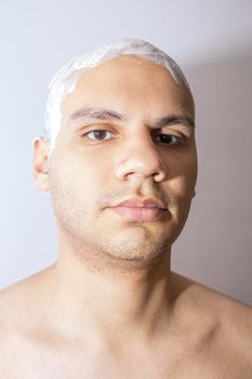 Man Shaving His Head Using White Foam