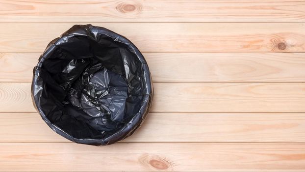 Empty Bin on Wooden Floor. Trash Can Top View. Empty Garbage Bin Banner. Banner Garbage Basket Waste Can with Plastic Package. Waste Bin on Wooden Background Floor. Black Bag in Trash Can. Rubbish Bin