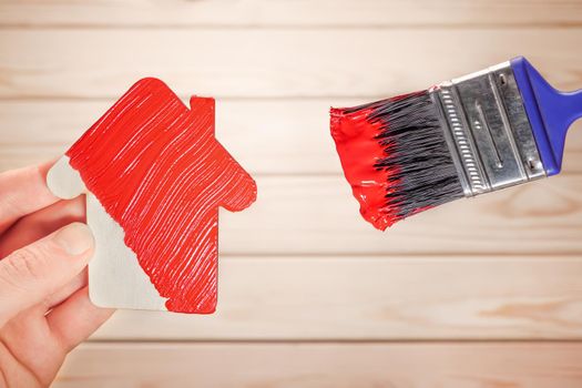 Painting work house icon renovation home construction model. Symbol house painting brush in red colour. Make repair house decoration paint home improvement. New home remodeling renovation paint facade