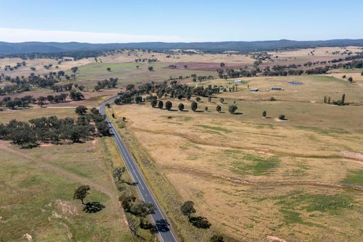 Drone aerial photograph of large green agricultural fields in regional New South Wales in Australia