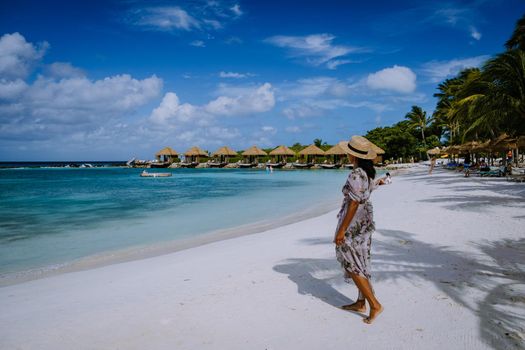 Aruba March 2021 beach with pink flamingos at the beach, flamingo at the beach in Aruba Island Caribbean. A colorful flamingo at beachfront, Renaissance Island Aruba 