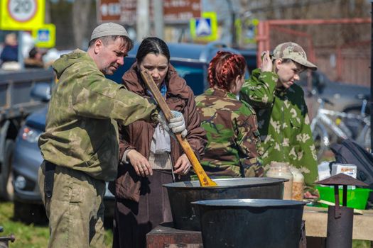 Reconstruction of the Second World War. Field kitchen, preparing food for the soldiers. The Great Patriotic War. Liberation of Odessa. Zelenograd Russia April 18, 2021