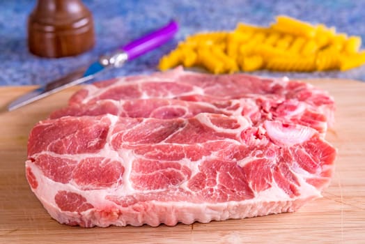 raw pork chop in a closeup