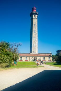 Phare des Baleines in Saint-Clément-des-Baleines on the isle of  ile de Ré in France with tourist on a sunny day during summer