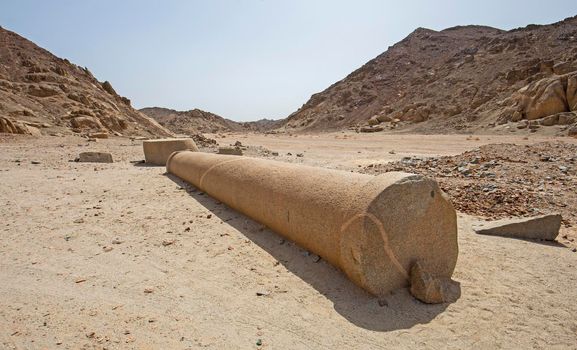 View across old abandoned column pillar at Roman quarry town Mons Claudianus in Egyptian eastern desert