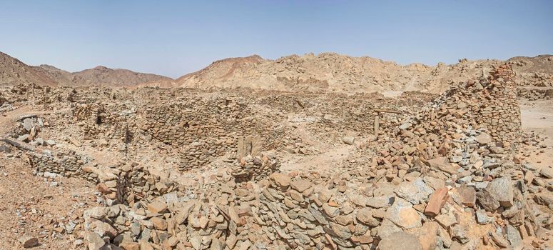 View across old abandoned ruins of Roman quarry town buildings at Mons Claudianus in Egyptian eastern desert