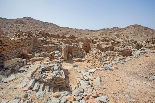 View across old abandoned ruins of Roman quarry town buildings at Mons Claudianus in Egyptian eastern desert