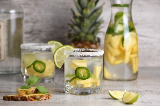 Spicy Margarita. Tequila Infused on Slices of Fresh Pineapple, Lime,  hot jalapeno