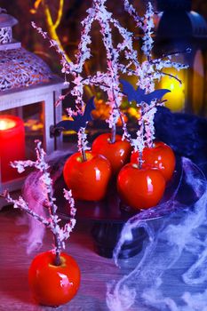 Halloween dessert. Poisoned blood caramelized glazed candy apple. Snow White Poison Lollipops. 