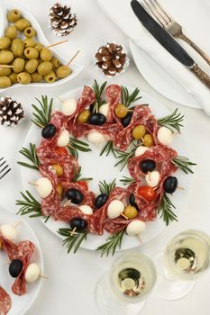  Christmas wreath - antipasto. Salami canapes with olives, baby mozzarella.