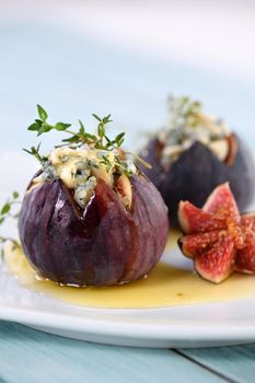 Figs stuffed with blue cheese and thyme, seasoned with honey