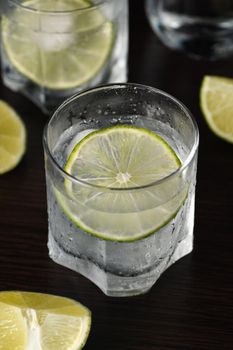 Gin and tonic with a slice of lime 