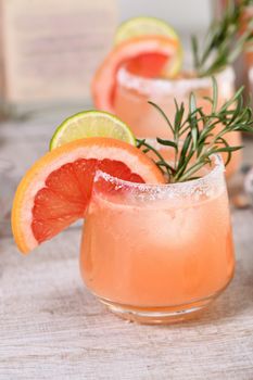 Cocktail fresh lime and rosemary combined with fresh grapefruit juice and tequila. A festive drink is ideal for brunch, parties and holidays.