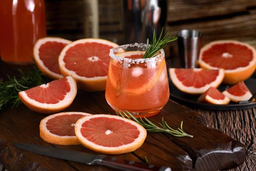 Cocktail tequila fresh grapefruit juice combined and rosemary. A festive drink is ideal for brunch, parties and holidays.