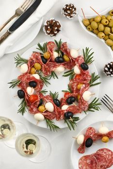  Christmas wreath - antipasto. Salami canapes with olives, baby mozzarella.