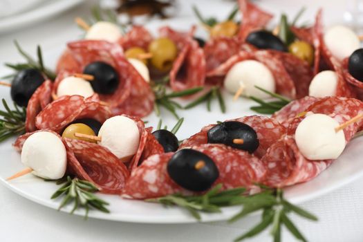  Christmas wreath - antipasto. Salami canapes with olives, baby mozzarella.