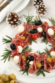  Christmas wreath - antipasto. Salami canapes with olives, baby mozzarella.