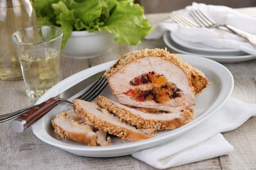 turkey breast stuffed with dried prunes, dried apricots and cherries in breadcrumbs and parmesan breading