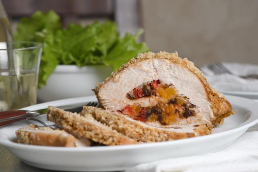 turkey breast stuffed with dried prunes, dried apricots and cherries in breadcrumbs and parmesan breading