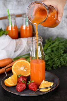 Detox drink. Freshly made Carrot Strawberry Orange Juice. For those who monitor their health