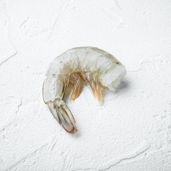 Raw shell on king prawns set, on white stone surface, top view flat lay, square format