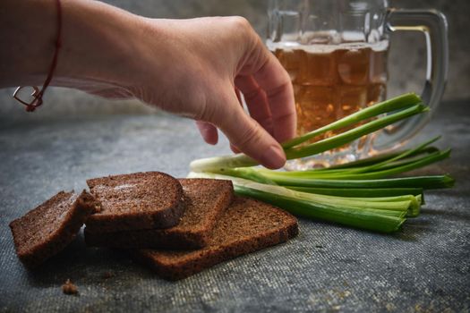 Bread with salt, green onions and beer