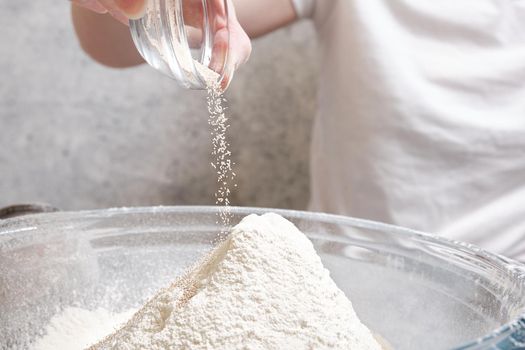 Flour is sieved with a metal sieve