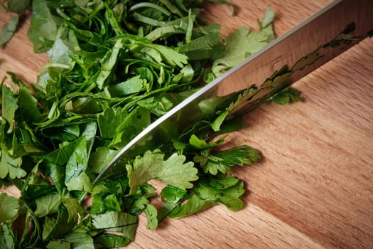 Chopping parsley on a cutting board