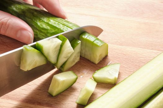 Cucumber cut into several pieces with a knife