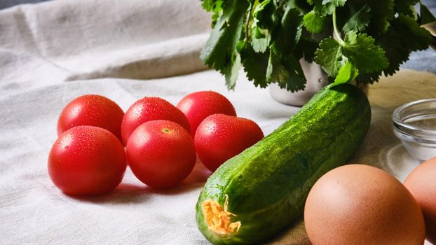 Tomatoes, cucumbers, eggs and herbs